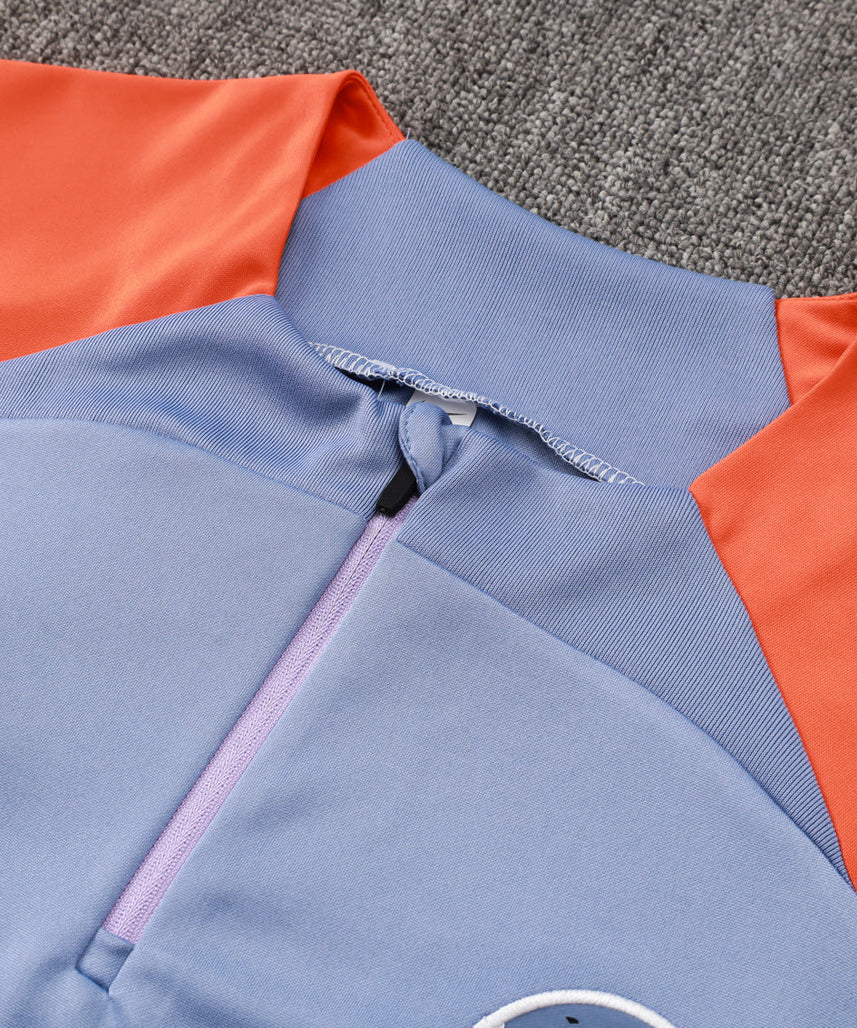 طقم رياضي أزرق فاتح وبرتقالي من إنتر ميلان