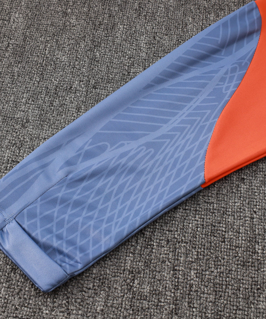 طقم رياضي أزرق فاتح وبرتقالي من إنتر ميلان