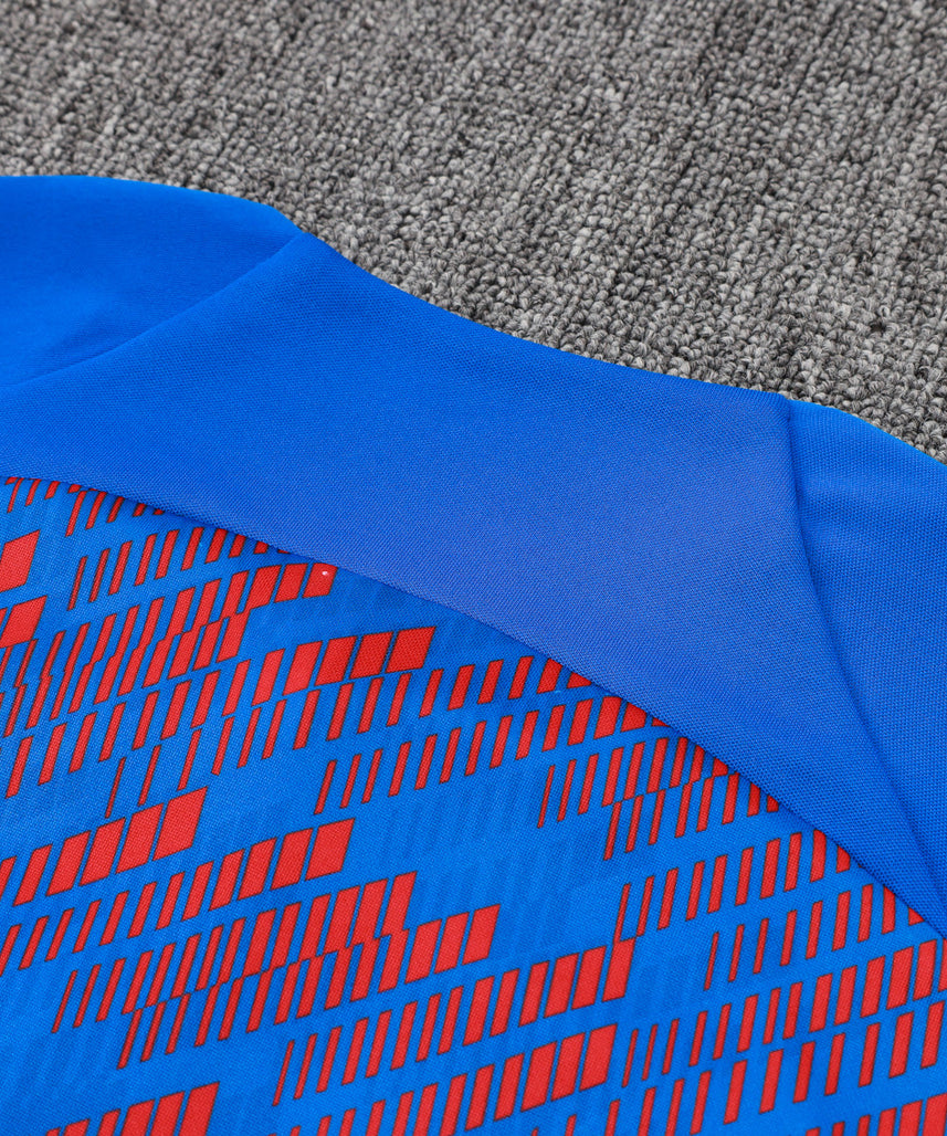 بدلة رياضية زرقاء داكنة وزرقاء من نادي برشلونة