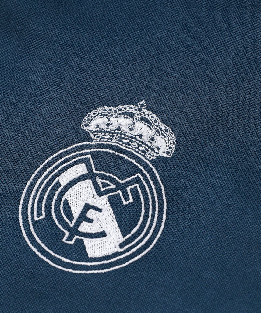 بدلة رياضية لريال مدريد باللونين الأزرق الداكن والأصفر